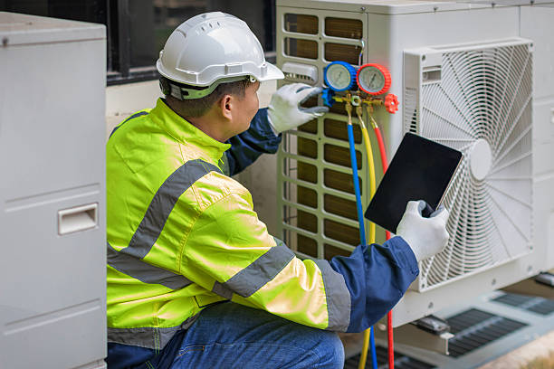 Professional Air Conditioning Repair technician working in Coloma, MI